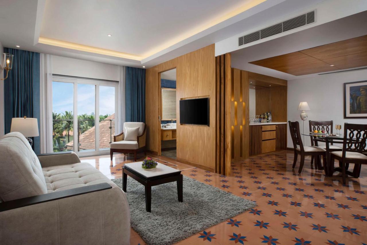 Luxury suite with Balcony & Living room - 10% Discount of Food & Soft Beverages and SPA, 1 Goan Wine Bottle -  INR 500 Hotel Credit (minimum spend of INR 5000), Early Check-In upto 2 hours (subject to availability)